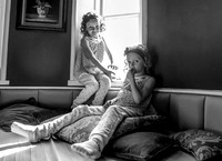Sisters in the window seat